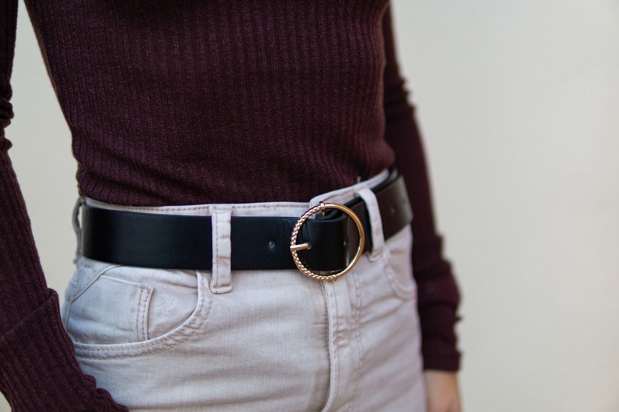 A woman in black leather belt