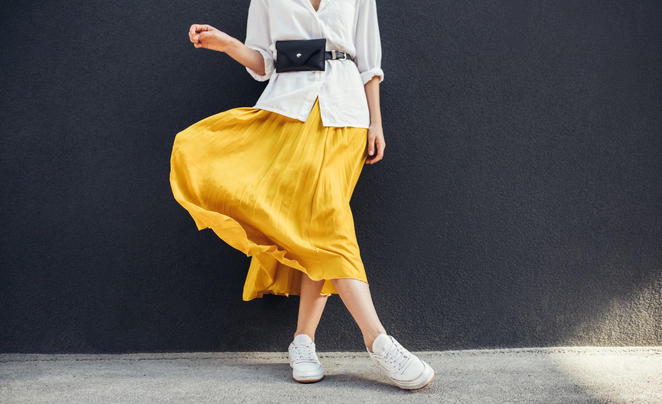 A woman wearing a black belt bag