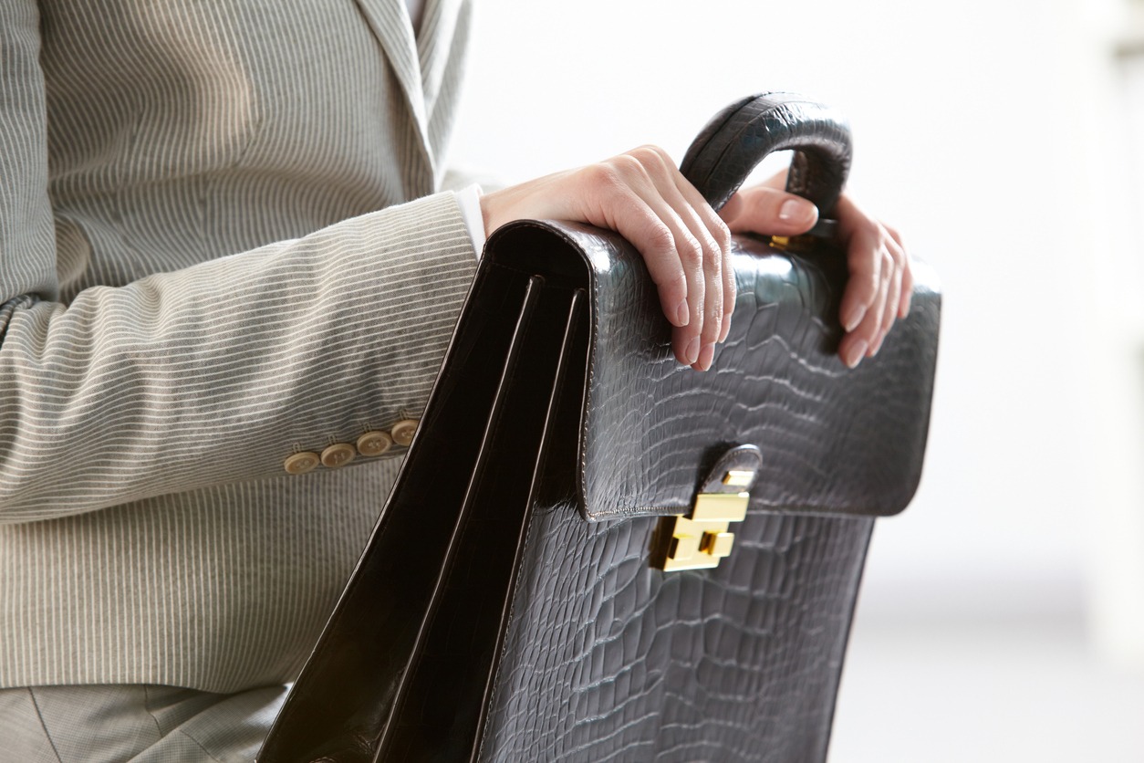 A dark brown leather briefcase with an outside compartment